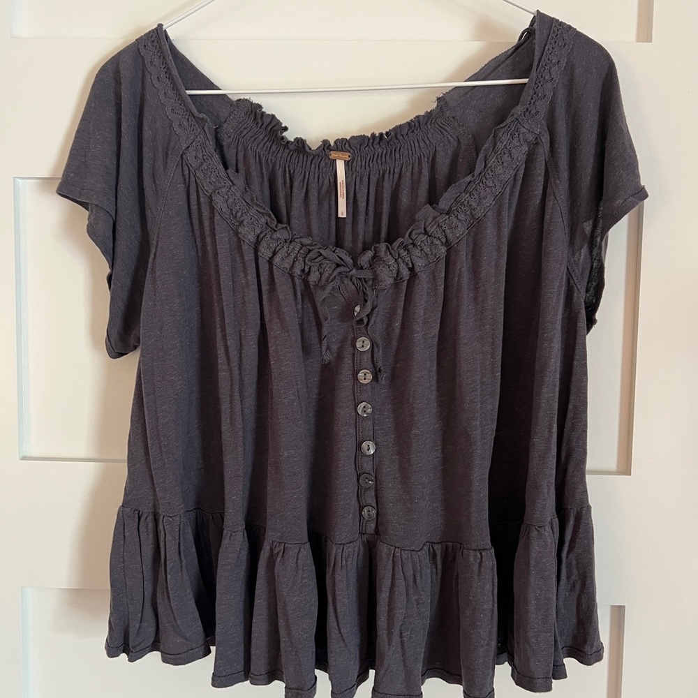 Free people distressed blue casual top, size small but slightly oversized